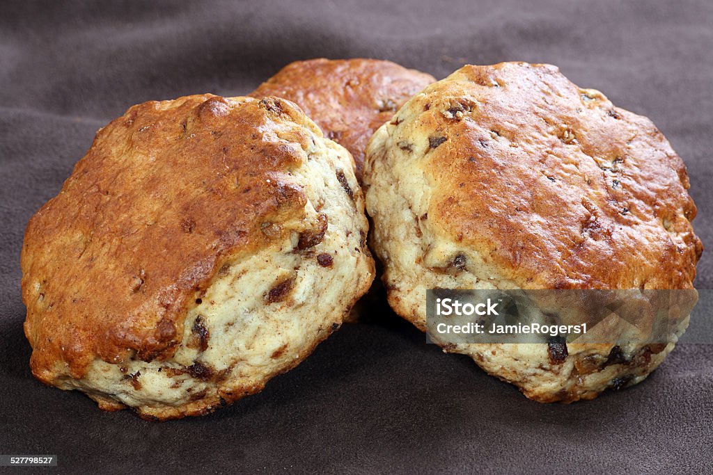 date and maple scones closeup of three date and maple syrup scones Baked Stock Photo