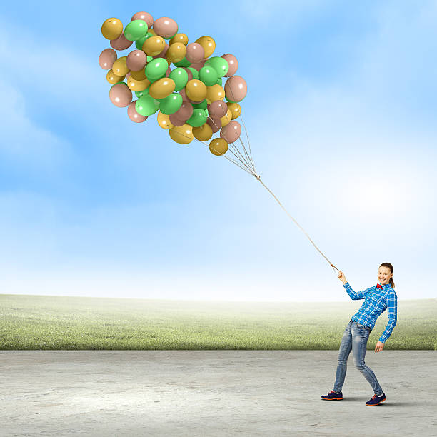 istock Woman with balloons 527798919