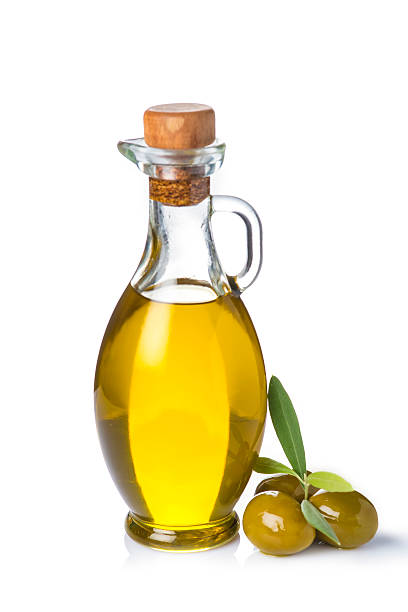 istock Extra olive oil bottle and green olives on white background 527798953
