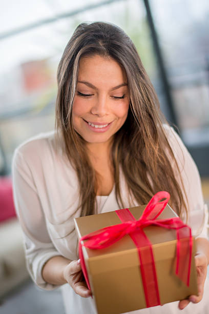 istock Woman holding a present 527798989