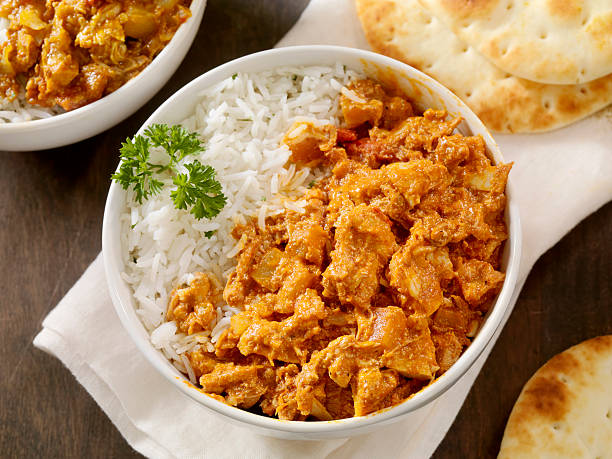 Butter Chicken Butter Chicken with Basmati Rice and Naan Bread -Photographed on Hasselblad H1-22mb Camera chicken curry stock pictures, royalty-free photos & images