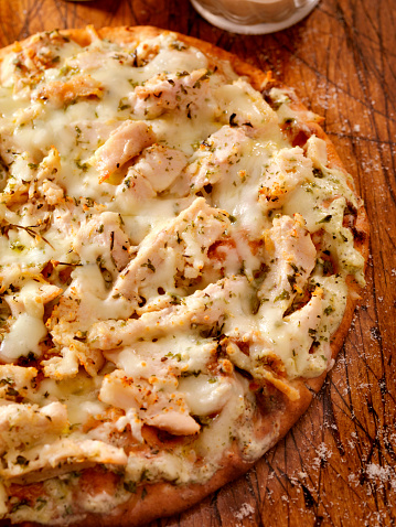 Authentic Italian, Hand Made Grilled Chicken Flat Bread with Fresh Parmesan and an Alfredo Sauce. Could also be Ranch Chicken or Chicken Ceaser- Photographed on a Hasselblad H3D11-39 megapixel Camera System