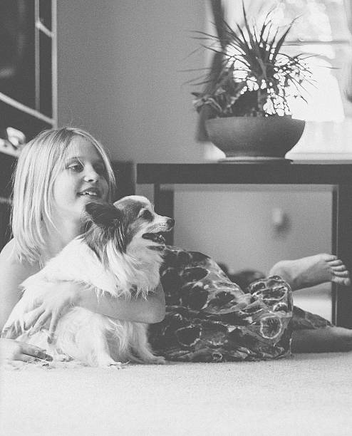 istock Little Girl hugging Dog 527800115