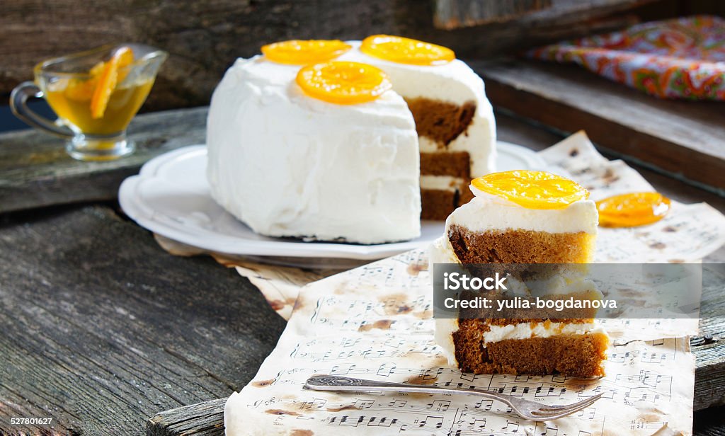 carrot cake, decorated with candied oranges honey-carrot cake, decorated with candied oranges Backgrounds Stock Photo