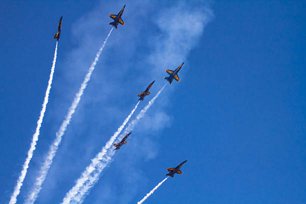 US NAVY Blue Angels Squadron Miramar, USA - October 4, 2014: Miramar, California, USA- October 4, 2014 Blue Angels- The US Navy Flight Demonstration Squadron showing precision flying with their Boeing F/A-18 Hornet aircraft at the 2014 Miramar airshow in California. On this hot day the were many aircraft representing each military branch and displaying their aviation force. supersonic airplane editorial airplane air vehicle stock pictures, royalty-free photos & images