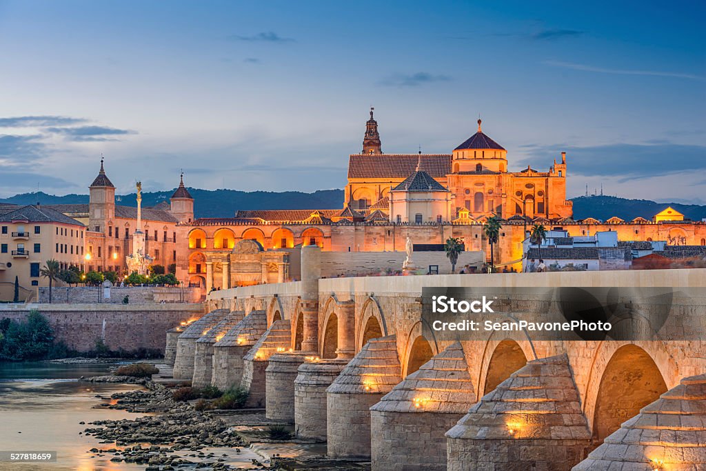 Cordoba, Spain at the Roman Bridge and Mosque-Cathedral Cordoba, Spain view of the Roman Bridge and Mosque-Cathedral on the Guadalquivir River. Cordoba - Spain Stock Photo