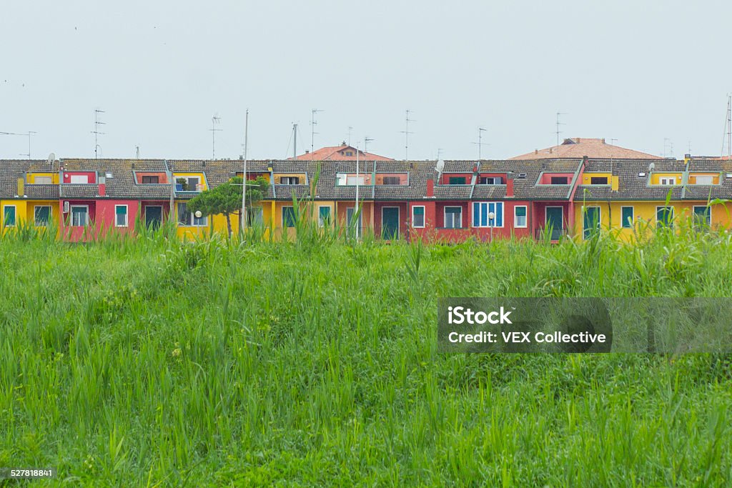 Colorful houses in the Venetian lagoon with private mooring Blue Stock Photo