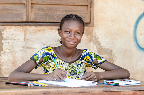 istock School Symbol: Super Gorgeous African Schoolgirl Light Smile 527818997