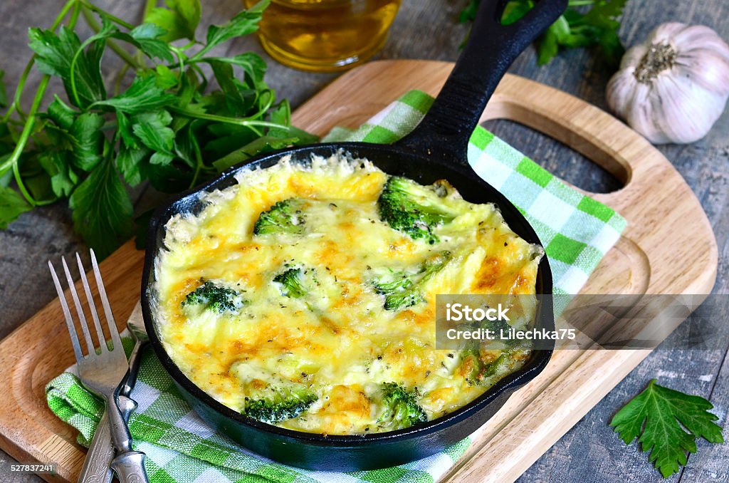 Frittata with potato and broccoli. Frittata with potato and broccoli in a frying pan. Broccoli Stock Photo