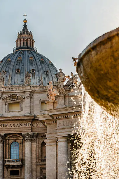 St Peter's Basilica Cathedral architecture detail fountain in foreground