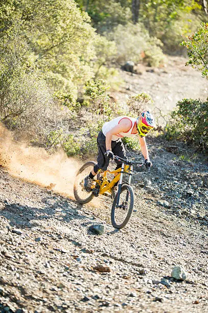 Young man doing bike jump