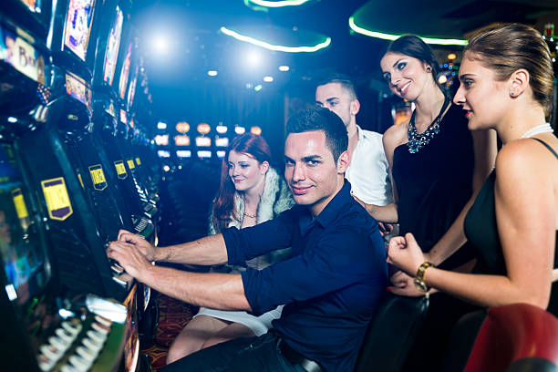 istock Group of people playing slot machines 527838649