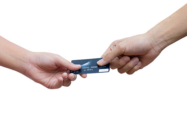 Holding and giving credit card over white background