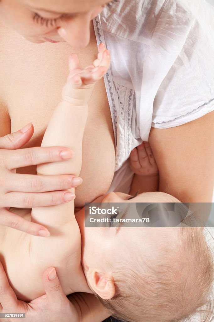 Breastfeeding Mother breast feeding the baby Adult Stock Photo