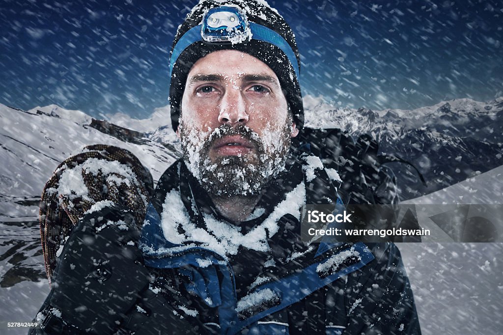 Adventure mountain man Adventure mountain man in snow expedition with climbing gear and determination Men Stock Photo