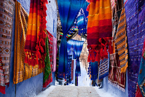 Chefchaouen Medina, Morocco On the narrow streets Chefchaouen seliing carpets, Morocco. chefchaouen photos stock pictures, royalty-free photos & images