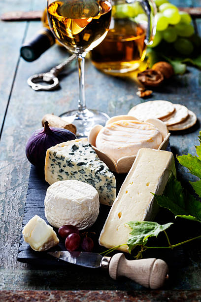 istock Various types of cheese and white wine 527844039