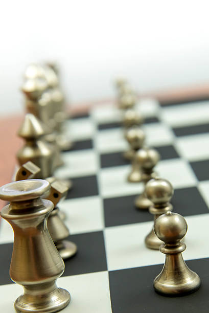 istock chess game - view of playing pieces on chessboard 527844171
