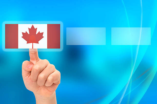 istock Young Asian boy hand touching button selecting Canadian option 527844495