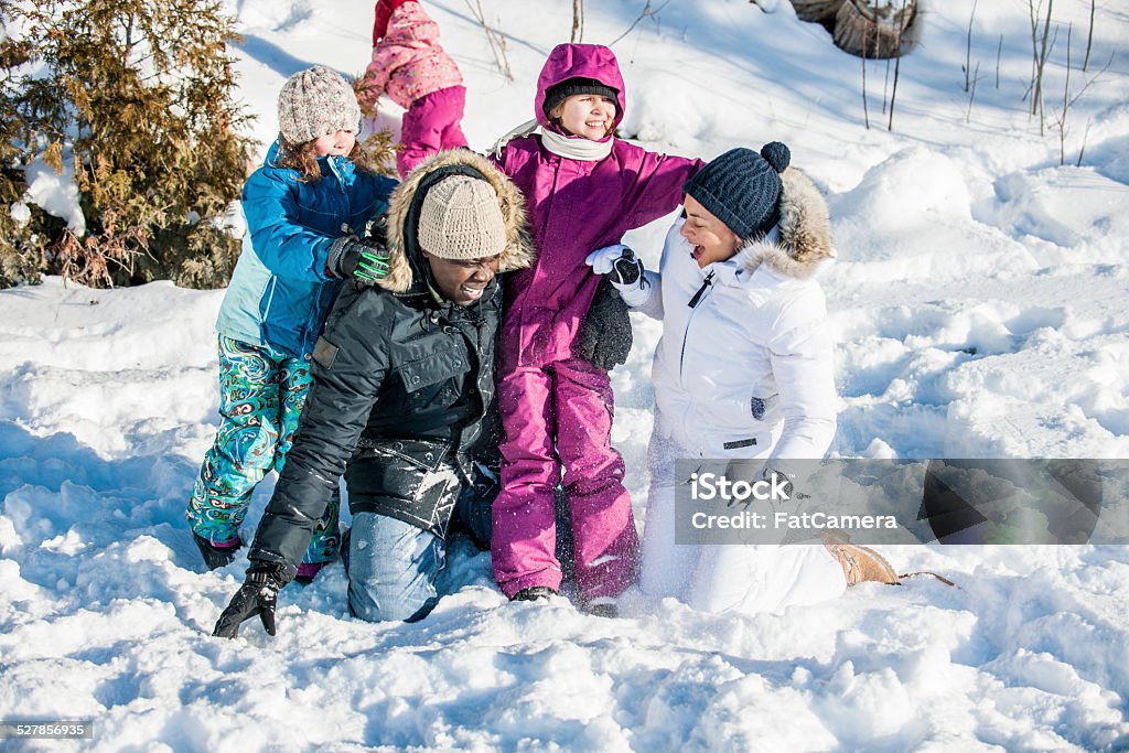 Winter time Family enjoying the outdoors in the winter time. Family Stock Photo