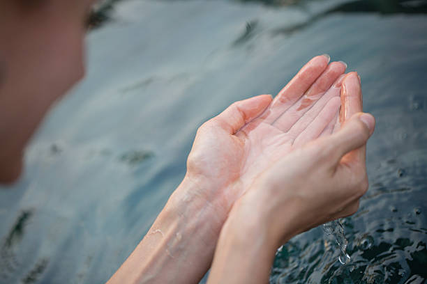 istock Woman touching water 527858575