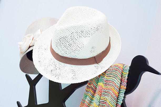istock Bright colored scarf with hat hanging on a rack 527859561