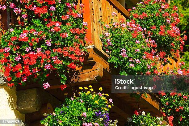 Swiss Alpine Chalet Mountain Hut Balcony Full Of Flowers Stock Photo - Download Image Now
