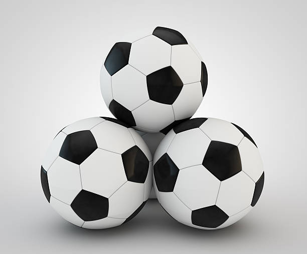 istock four soccer balls faced pyramid on white 527860717
