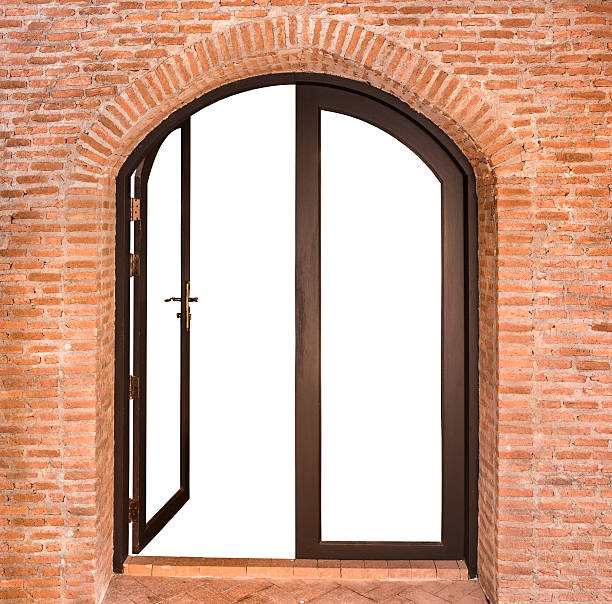 istock arch door on red brick wall background 527860801