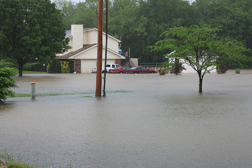 Spring Hill, Tennessee – May 1, 2010: Overflow in the Rutherford Creek watershed floods residential property along Port Royal Road during the May 2010 Tennessee floods. Referred to as the 1000 year flood record rainfall totals were recorded throughout Middle Tennessee.