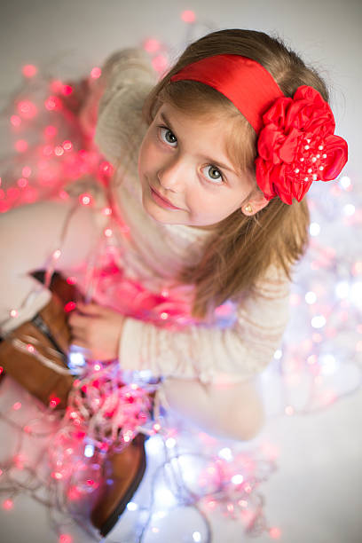 istock Smiling pretty girl on colored lights. 527862543
