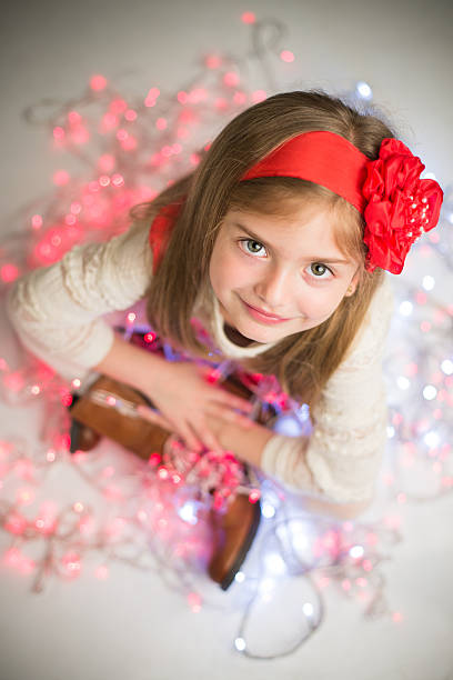 istock Smiling pretty girl on colored lights. 527862545