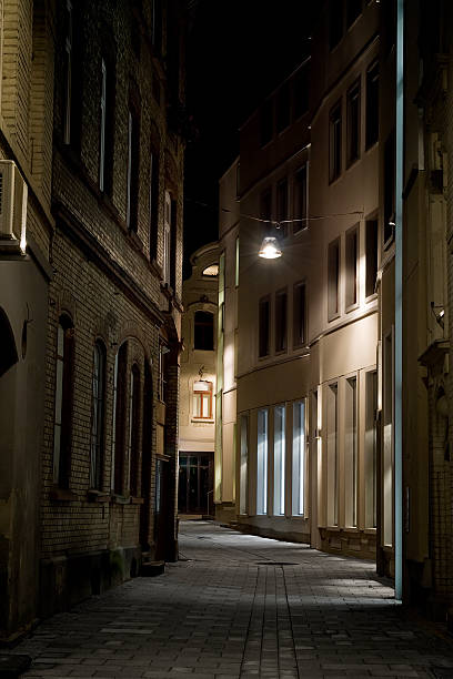 istock Narrow alley at night 527862669