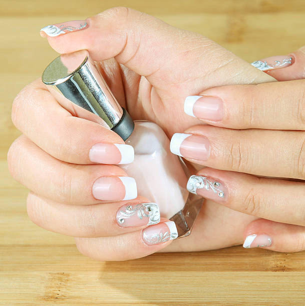 istock Beautiful woman's nails with beautiful french manicure. 527864409