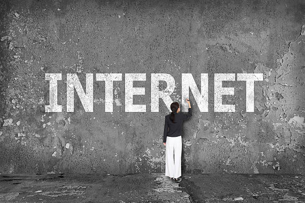 istock businesswoman drawing internet on the wall 527877415