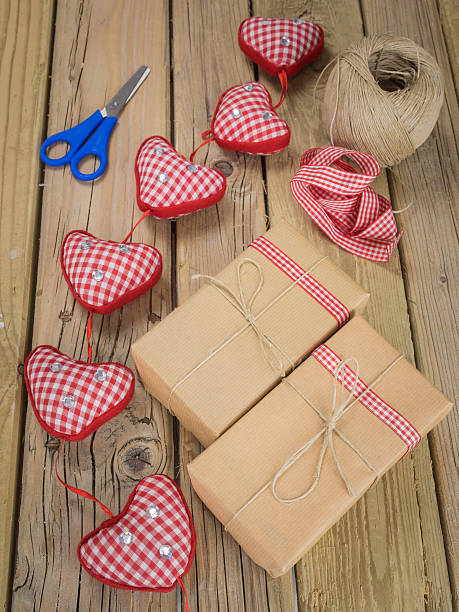 istock brown paper parcels with ribbon and scisso 527878005