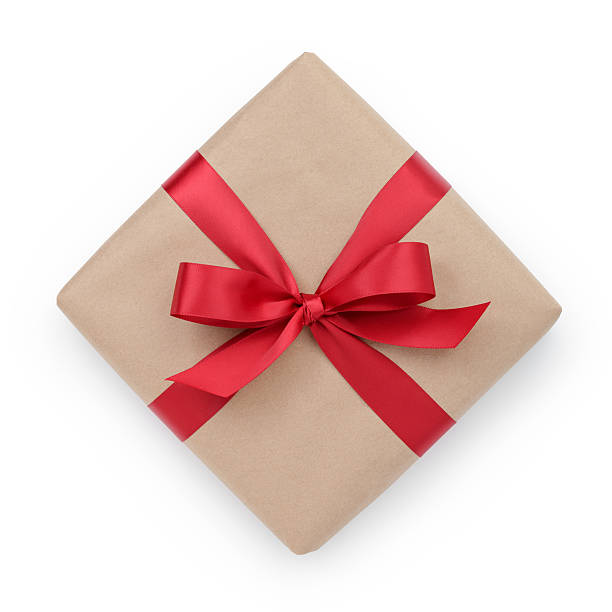 istock kraft paper gift box with ribbon bow from above 527879347
