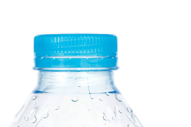 istock Close up blue cap of plastic bottle isolated on white 527879823