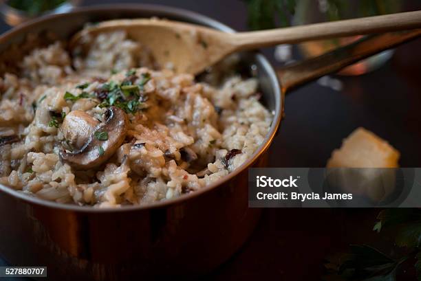 Mushroom And Sundried Tomato Risotto In A Copper Saucepan Stock Photo - Download Image Now