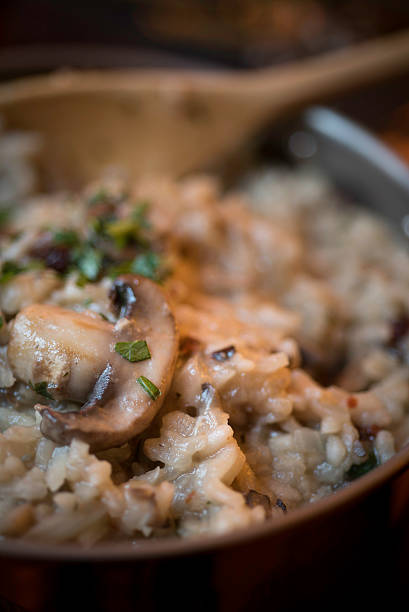 istock Mushroom and Sun-dried Tomato Risotto in a Copper Saucepan 527880709