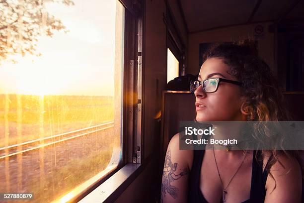 Young American Travels Thailand By Train At Sunrise Stock Photo - Download Image Now