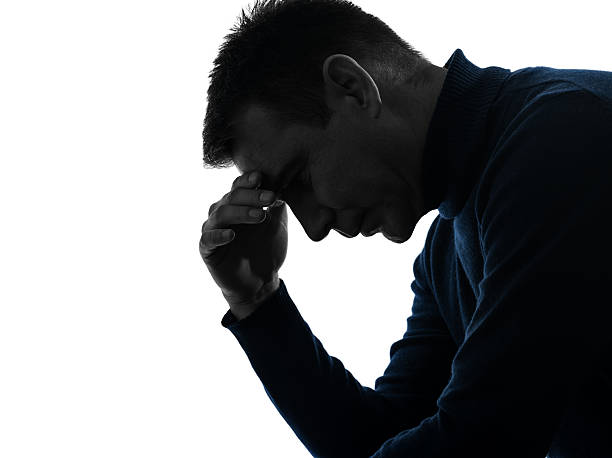 istock man serious thinking pensive silhouette portrait 527881051