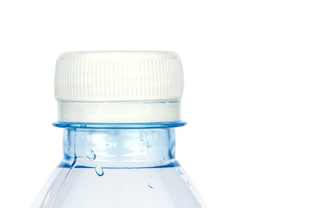 istock Close up white cap of plastic bottle isolated on white 527881289