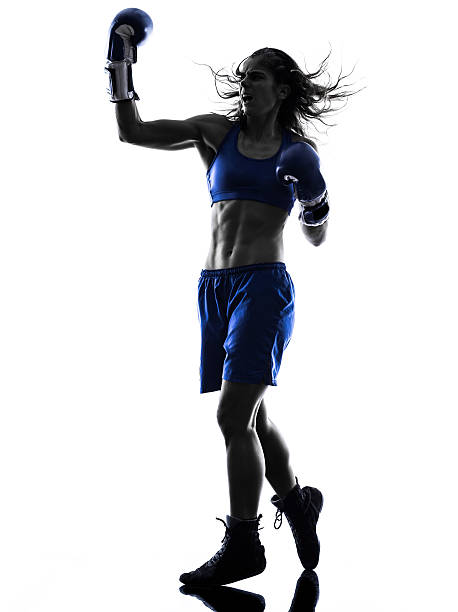 istock woman boxer boxing kickboxing silhouette isolated 527881825