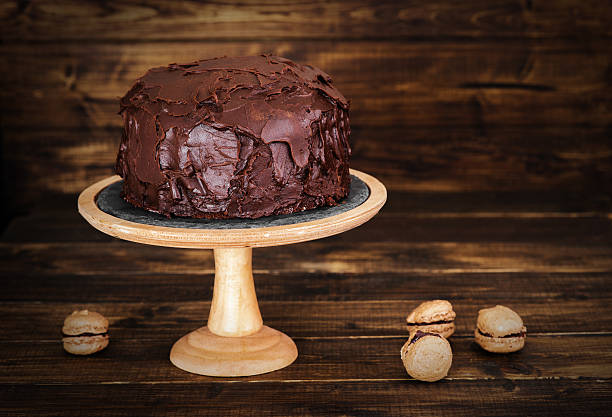 istock Chocolate cake on dark wooden bckground 527882846