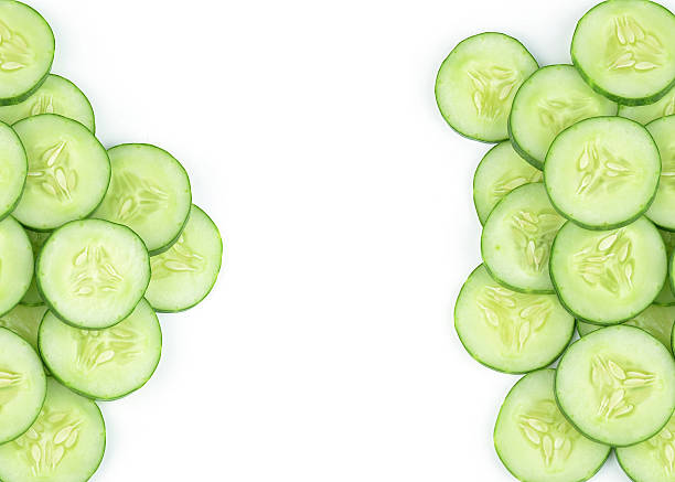 istock Cucumber and slices isolated over white background 527882991