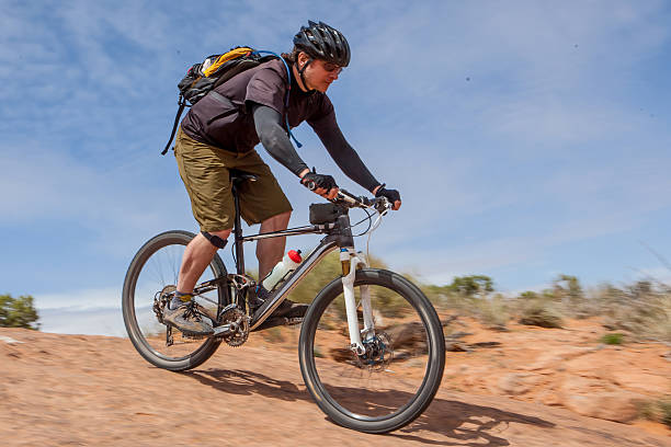 istock Mountain biker on a slickrock trail in Moab Utah. 527883724