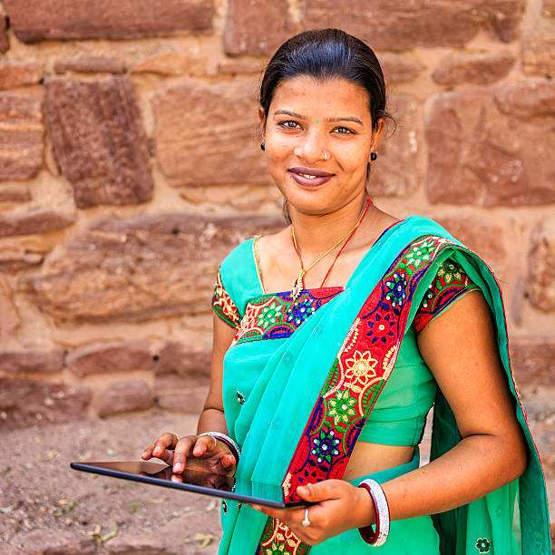 istock Young Indian woman using digital tablet, Jodhpur, India 527883902