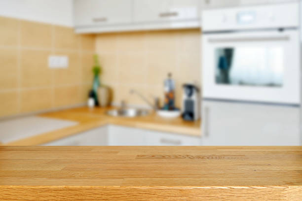 istock Wodden table with kitchen counter and sink background 527886106