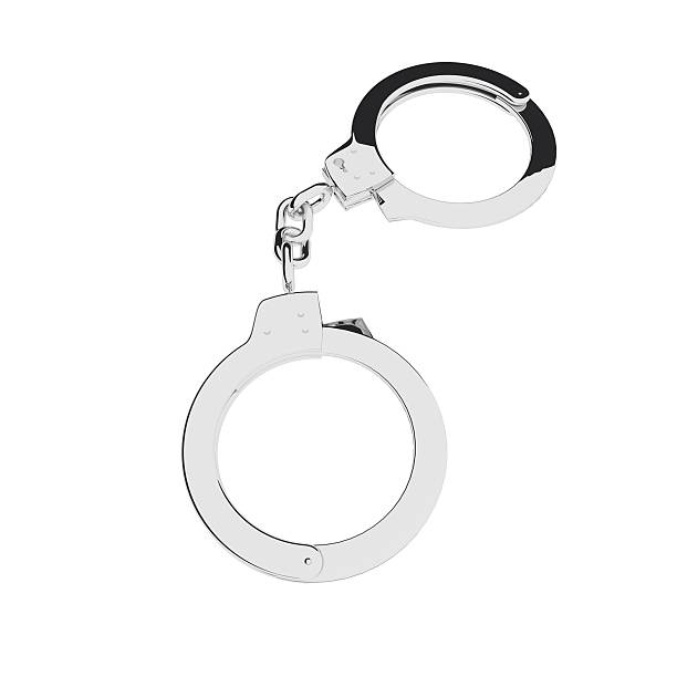 istock Metal handcuffs isolated over white 527886236
